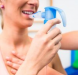 Patient using inhaler for respiratory treatment”